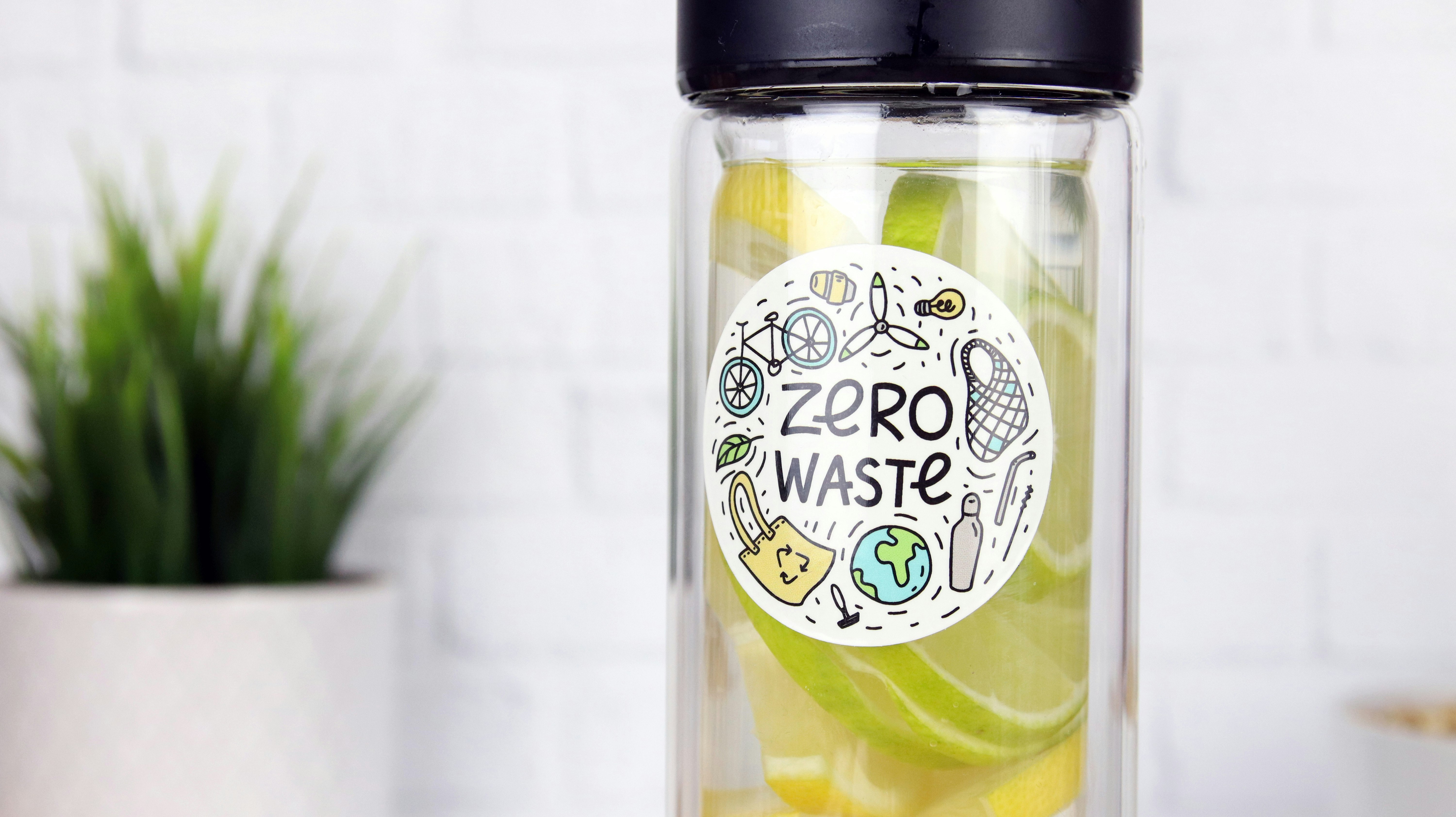 Circle eco-friendly sticker applied to a clear water bottle